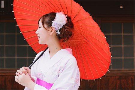 red home people - Japanese woman in Yukata holding a traditional paper parasol Stock Photo - Rights-Managed, Code: 859-06404928