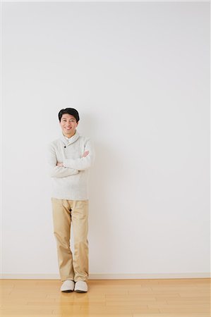 slippers - Mature adult man standing in front of a white wall with crossed arms Stock Photo - Rights-Managed, Code: 859-06469853