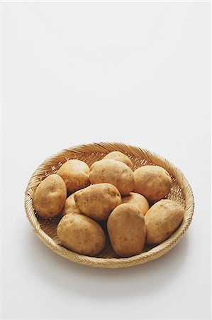 potato - Potatoes in a wooden basket on a table Stock Photo - Rights-Managed, Code: 859-06469980