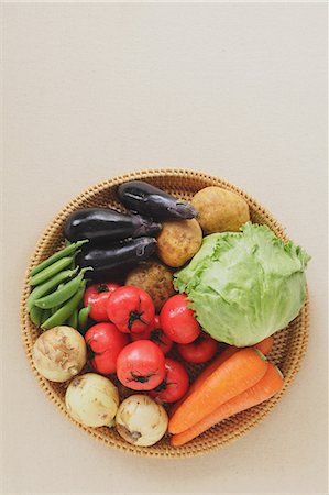 Mixed vegetables in a wooden basket on the table Photographie de stock - Rights-Managed, Code: 859-06470001