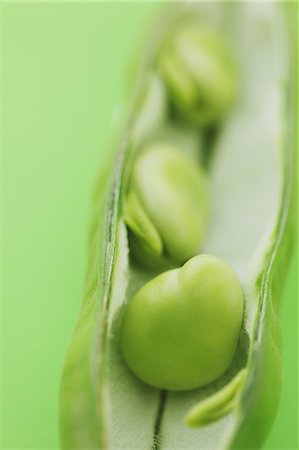 pisum sativum - Broad beans on green background Stock Photo - Rights-Managed, Code: 859-06470263