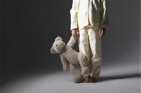 Girl in a pajama holding a teddy bear Photographie de stock - Rights-Managed, Code: 859-06537717