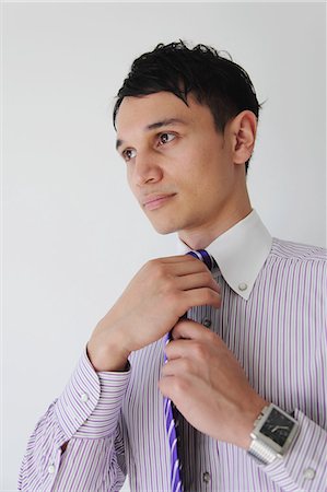 dress shirts side - Businessman tying necktie Stock Photo - Rights-Managed, Code: 859-06537809