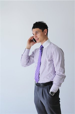 picture of person talking on string telephone - Businessman talking on the phone Stock Photo - Rights-Managed, Code: 859-06537813