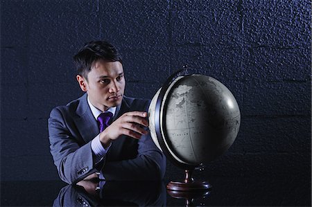 presiding - Businessman with globe Stock Photo - Rights-Managed, Code: 859-06537872