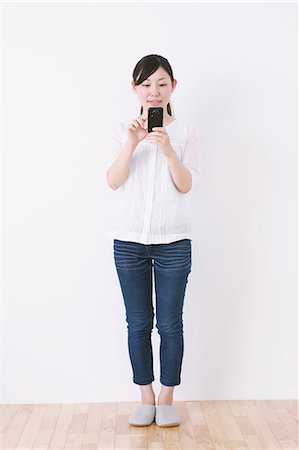 email white background - Woman using Smartphone Stock Photo - Rights-Managed, Code: 859-06537898