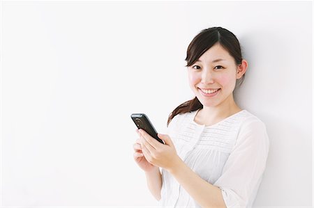 récepteur - Woman using Smartphone Photographie de stock - Rights-Managed, Code: 859-06537900