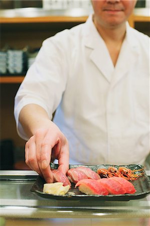 servicio completo - Chef preparing sushi Foto de stock - Con derechos protegidos, Código: 859-06537935