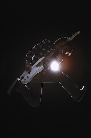 Guitarist jumping Photographie de stock - Rights-Managed, Code: 859-06537951