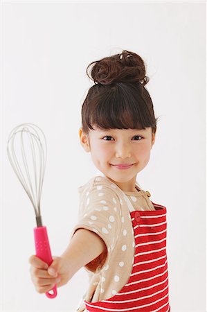 equipment and utensils with picture - Young girl with apron smiling at camera Stock Photo - Rights-Managed, Code: 859-06537987