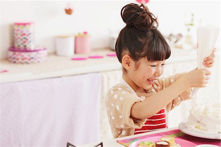 east asian cooking - Young girl making a cake Stock Photo - Rights-Managed, Code: 859-06537982