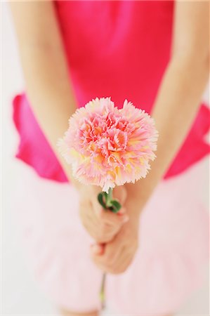 danksagung - Young girl with flower Photographie de stock - Rights-Managed, Code: 859-06537992