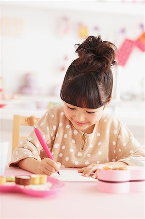 pink paper - Young girl writing at her desk Stock Photo - Rights-Managed, Code: 859-06537993