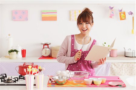 eggs whisk bowl - Young woman in a kitchen Stock Photo - Rights-Managed, Code: 859-06538002