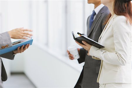 real estate and suit - Businesspeople talking by the window Stock Photo - Rights-Managed, Code: 859-06538166