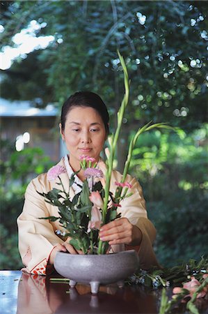 Woman in a kimono performing flower arrangement Stock Photo - Rights-Managed, Code: 859-06538334