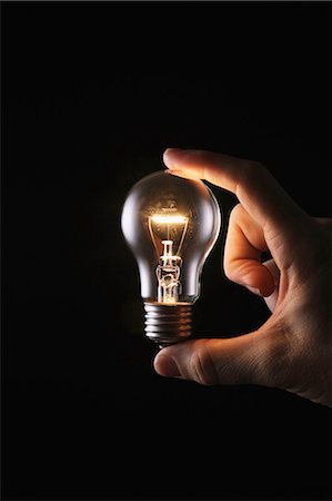 saving electricity - Hand With Light Bulb Stock Photo - Rights-Managed, Code: 859-06617280