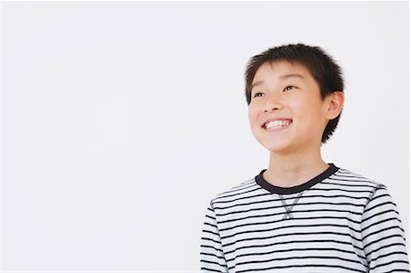 preteen boy happy white background - Boy Smiling Photographie de stock - Rights-Managed, Code: 859-06617330
