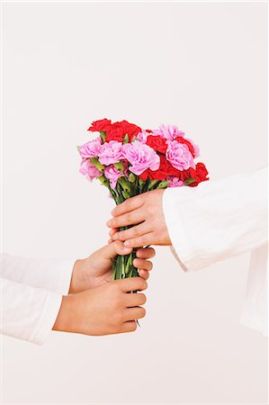 Daughter Giving Bouquet To Her Mother Stock Photo - Rights-Managed, Code: 859-06617350