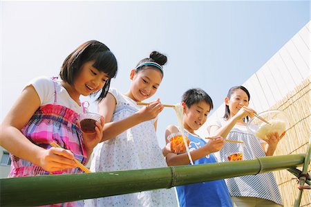 family summer lunch - Children Enjoying the Flowing Somen Stock Photo - Rights-Managed, Code: 859-06617390