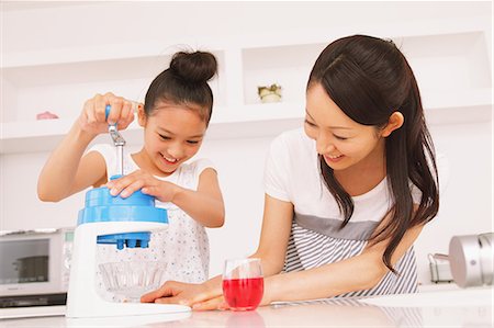 Mother And Daughter Making Shaved Ice Stock Photo - Rights-Managed, Code: 859-06617403