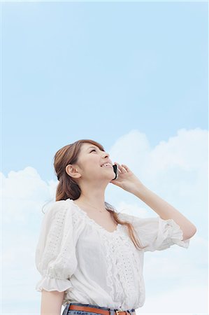 simsearch:859-06538080,k - Woman On the Phone Looking at the Sky Stock Photo - Rights-Managed, Code: 859-06617458