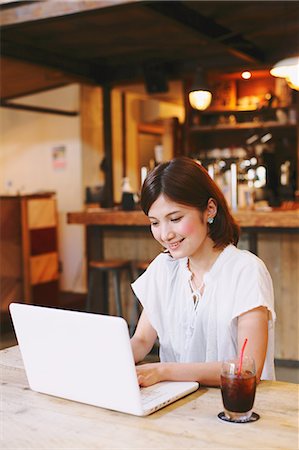 receiver - Woman Relaxing In a Cafe Stock Photo - Rights-Managed, Code: 859-06617492