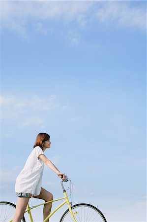 relax sky - Woman Riding a Bicycle Stock Photo - Rights-Managed, Code: 859-06617504