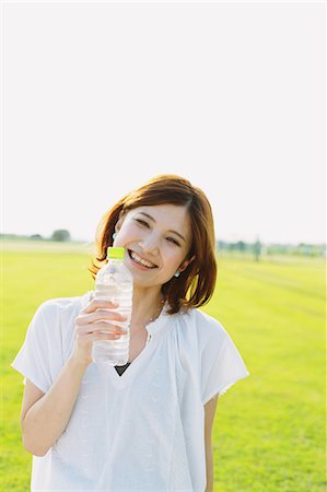 positive - Woman Holding a Pet Bottle Stock Photo - Rights-Managed, Code: 859-06617505