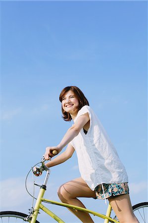 staken - Woman Riding a Bicycle Stockbilder - Lizenzpflichtiges, Bildnummer: 859-06617500