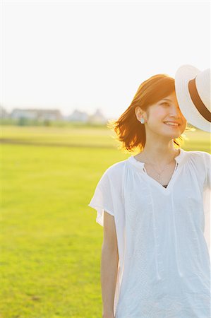 relief person - Woman With Straw Hat Closing Eyes Stock Photo - Rights-Managed, Code: 859-06617519