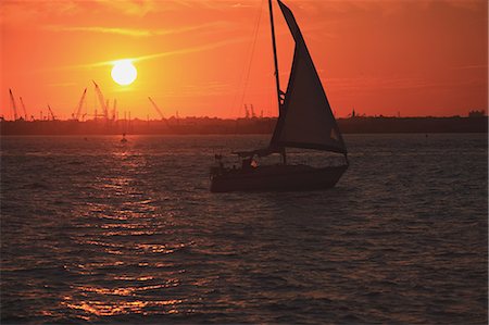 Boat sailing at sunset in New York, USA Stock Photo - Rights-Managed, Code: 859-06710877