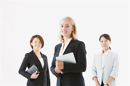 président (directeur) - Businesswomen smiling at camera Photographie de stock - Rights-Managed, Code: 859-06711017