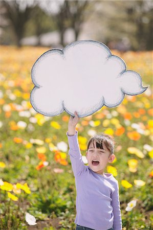 Young girl with cloud shaped drawing Stockbilder - Lizenzpflichtiges, Bildnummer: 859-06808411