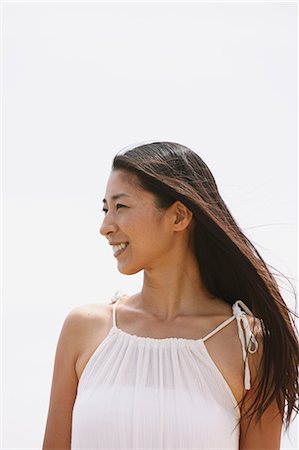 Woman in a white dress smiling away Stock Photo - Rights-Managed, Code: 859-06808527