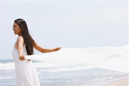 Woman in a white dress with white cloth on the beach Stock Photo - Rights-Managed, Code: 859-06808623