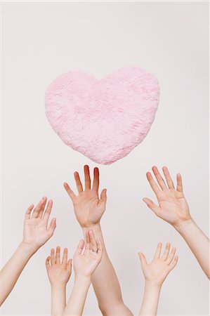 family symbol - Hands reaching out for heart Stock Photo - Rights-Managed, Code: 859-06808646