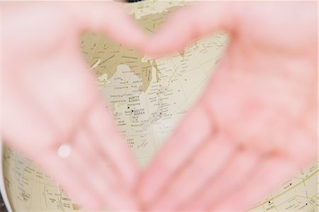 picture of the world in a heart shape - Hands and globe Stock Photo - Rights-Managed, Code: 859-06808666
