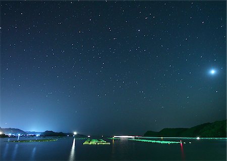 estrella (astronomía) - Night Sky and Calm Sea Foto de stock - Con derechos protegidos, Código: 859-07441519