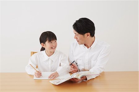 simsearch:859-07710990,k - Father helping daughter with homework Stock Photo - Rights-Managed, Code: 859-07710971