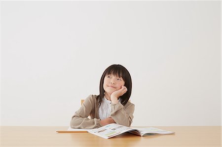 simsearch:859-07710990,k - Young girl doing her homework on wooden desk Stock Photo - Rights-Managed, Code: 859-07710995