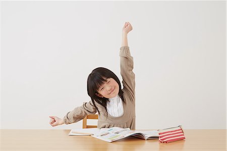 simsearch:859-07710990,k - Young girl doing her homework on wooden desk Stock Photo - Rights-Managed, Code: 859-07710998