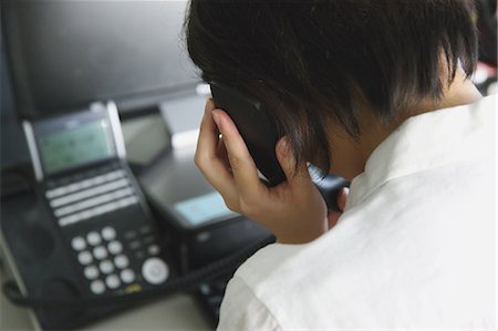 stressful workplace - Japanese young businesswoman depressed at her office desk Stock Photo - Rights-Managed, Code: 859-07711056