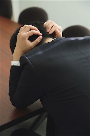 desk directly above - Desperate Japanese young businessman in a suit Stock Photo - Rights-Managed, Code: 859-07711064