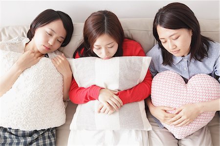 friends sleep sofa - Japanese roommates Stock Photo - Rights-Managed, Code: 859-07845807