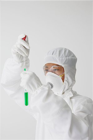 Young Japanese man in a protective suit working with chemicals Photographie de stock - Rights-Managed, Code: 859-08008326