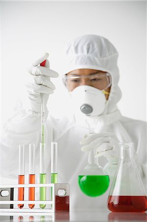 Young Japanese man in a protective suit working with chemicals Photographie de stock - Rights-Managed, Code: 859-08008339