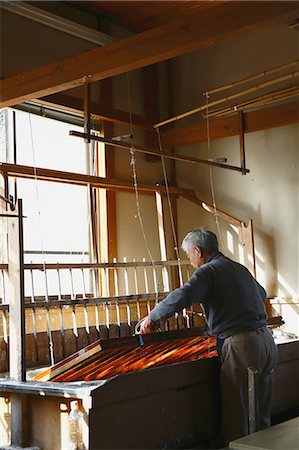 Japanese traditional paper craftsman working in his studio Stock Photo - Rights-Managed, Code: 859-08173152