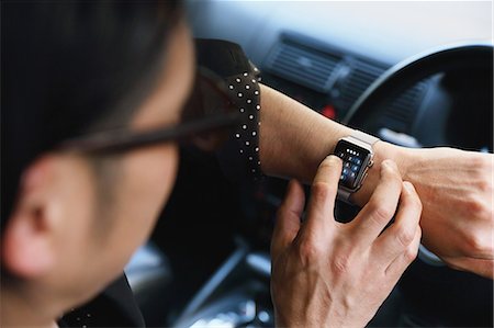 Japanese man in the car with wearable smart watch Stock Photo - Rights-Managed, Code: 859-08384660
