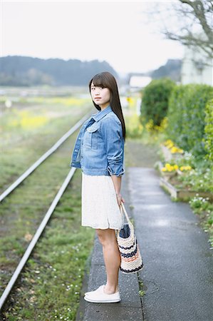 simsearch:859-08704133,k - Attractive young Japanese woman at local train station in the Japanese countryside Stock Photo - Rights-Managed, Code: 859-08704136